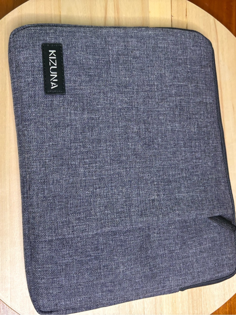 Kizuna water-resistant gray fabric laptop sleeve features a soft interior lining